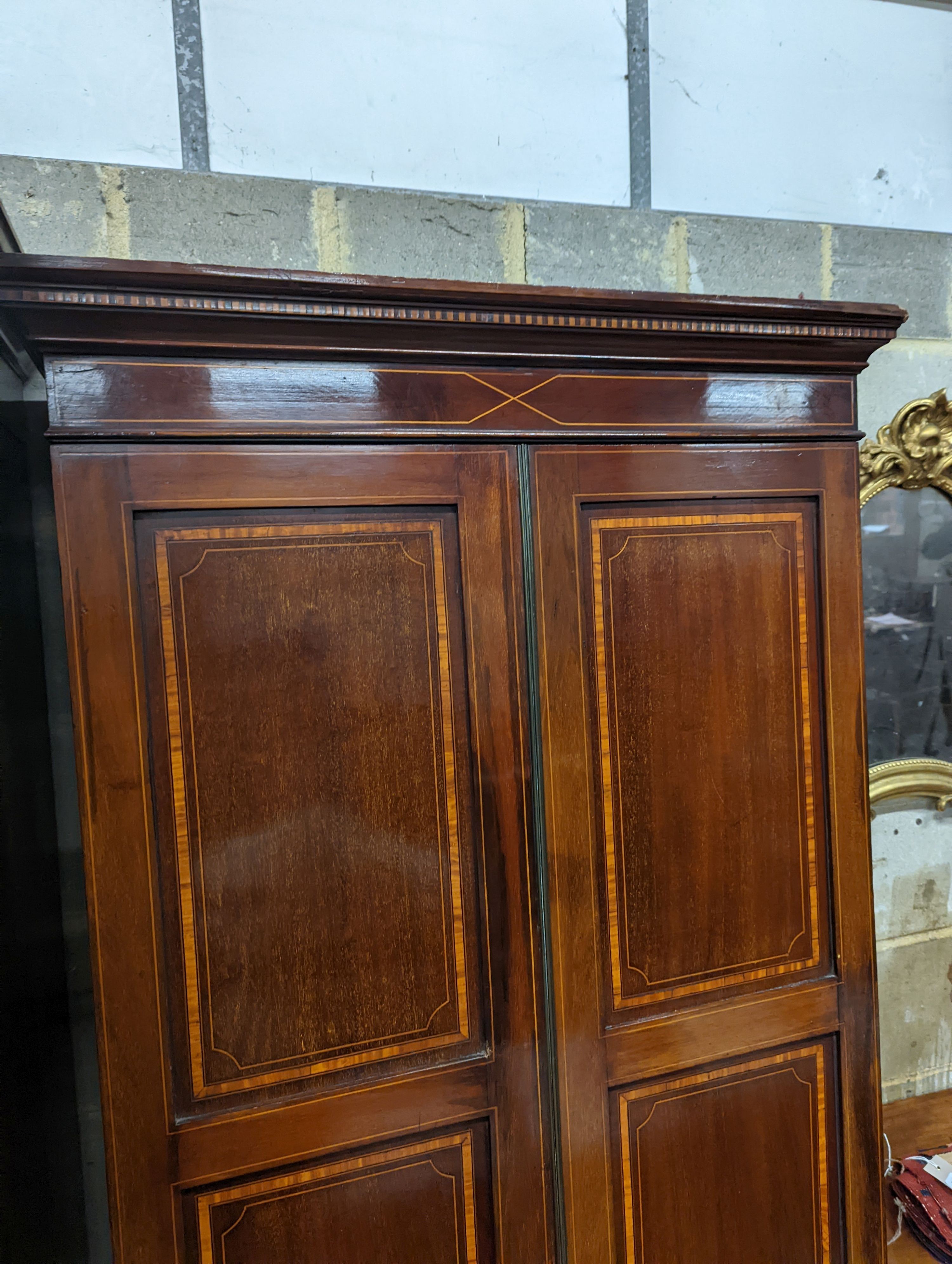 A Edwardian satinwood banded mahogany two door bookcase, width 83cm, depth 31cm, height 198cm